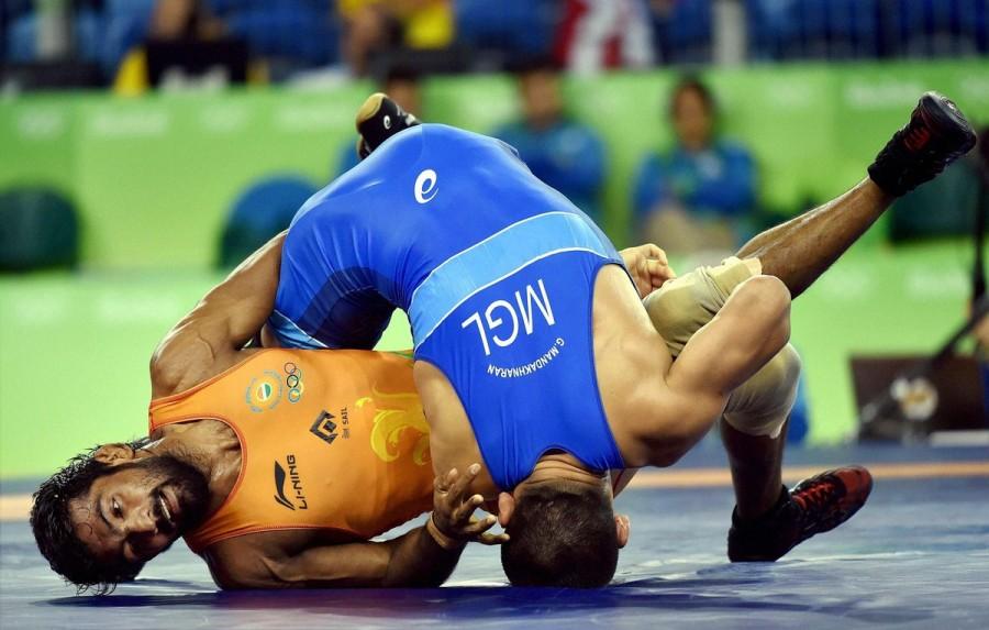 Indian wrestler Yogeshwar Dutt lost his men's freestyle 65 kg qualification match 0-3 against Mongolia's Mandakhnaran Ganzorig at the Rio Olympics here on Sunday. Yogeshwar Dutt.,Indian wrestler Yogeshwar Dutt,wrestler Yogeshwar Dutt,Mandakhnaran Ganzorig,Rio Olympics,Rio Olympics 2016,Rio Olympics pics