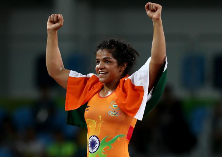 Wrestler Sakshi Malik, who opened India's account at the Rio Olympics with a bronze medal in the women's 58 kilogram freestyle category, will be carrying the flag at the closing ceremony on Sunday. Rio Olympics 2016,Wrestler Sakshi Malik,Sakshi Malik,Sakshi Malik at closing ceremony,closing ceremony,Rio closing ceremony,Rio 2016 closing ceremony,Sakshi to carry tricolour,Olympics closing ceremony,Olympics closing ceremony pics,Olympics closing cere