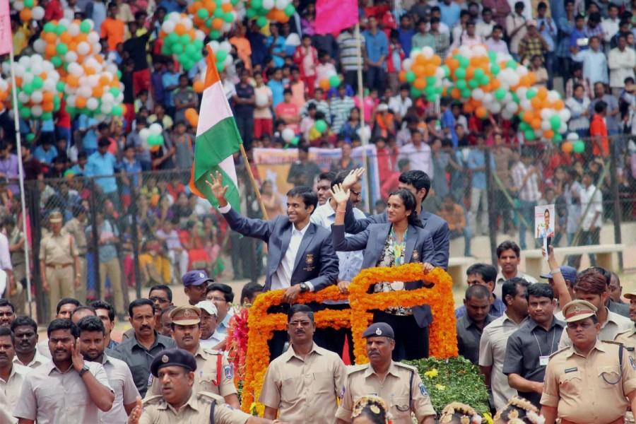 Olympic silver medal winner P.V. Sindhu arrived here on Monday to a hero's welcome. Accompanied by her coach Pullela Gopichand, the star shuttler was received at the airport by ministers and officials from both Telangana and Andhra Pradesh. PV Sindhu,Olympic silver medal winner P.V. Sindhu,Hyderabad welcomes PV Sindhu,PV Sindhu in Hyderabad,Pullela Gopichand,PV Sindhu with Silver Medal,PV Sindhu pics,PV Sindhu images,PV Sindhu photos,PV Sindhu stills