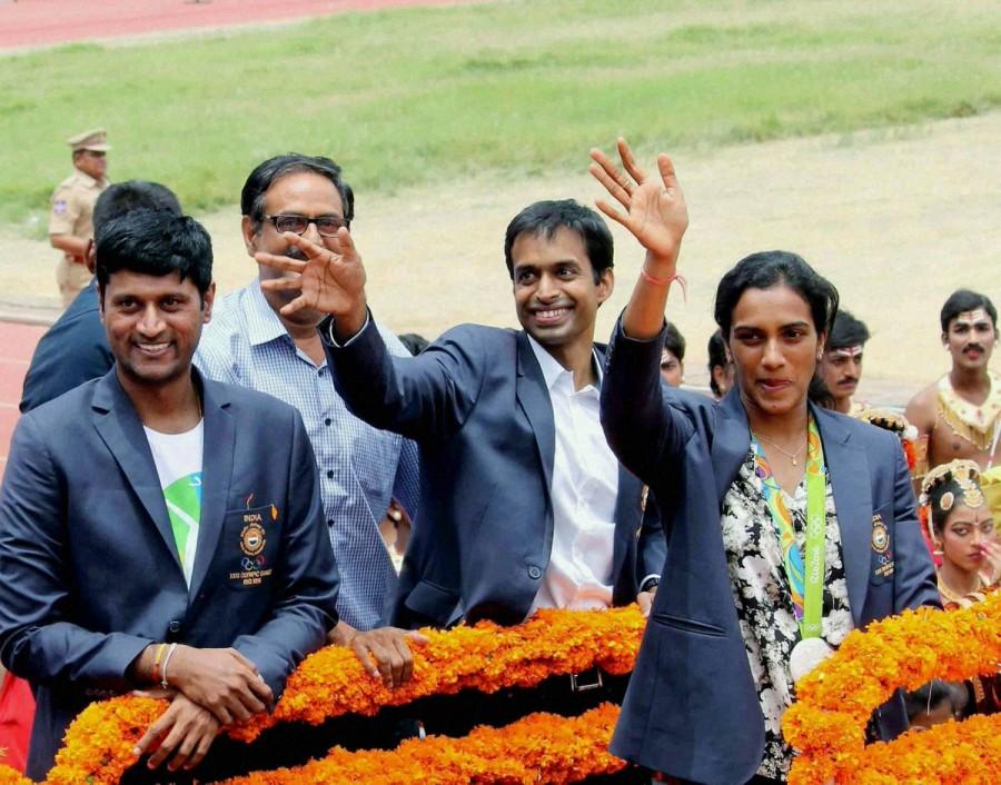 Olympic silver medal winner P.V. Sindhu arrived here on Monday to a hero's welcome. Accompanied by her coach Pullela Gopichand, the star shuttler was received at the airport by ministers and officials from both Telangana and Andhra Pradesh. PV Sindhu,Olympic silver medal winner P.V. Sindhu,Hyderabad welcomes PV Sindhu,PV Sindhu in Hyderabad,Pullela Gopichand,PV Sindhu with Silver Medal,PV Sindhu pics,PV Sindhu images,PV Sindhu photos,PV Sindhu stills
