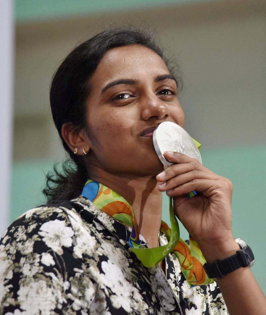 Olympic silver medal winner P.V. Sindhu arrived here on Monday to a hero's welcome. Accompanied by her coach Pullela Gopichand, the star shuttler was received at the airport by ministers and officials from both Telangana and Andhra Pradesh. PV Sindhu,Olympic silver medal winner P.V. Sindhu,Hyderabad welcomes PV Sindhu,PV Sindhu in Hyderabad,Pullela Gopichand,PV Sindhu with Silver Medal,PV Sindhu pics,PV Sindhu images,PV Sindhu photos,PV Sindhu stills