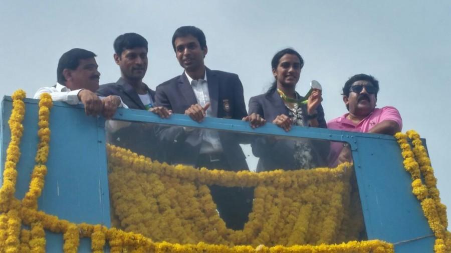 Olympic silver medal winner P.V. Sindhu arrived here on Monday to a hero's welcome. Accompanied by her coach Pullela Gopichand, the star shuttler was received at the airport by ministers and officials from both Telangana and Andhra Pradesh. PV Sindhu,Olympic silver medal winner P.V. Sindhu,Hyderabad welcomes PV Sindhu,PV Sindhu in Hyderabad,Pullela Gopichand,PV Sindhu with Silver Medal,PV Sindhu pics,PV Sindhu images,PV Sindhu photos,PV Sindhu stills