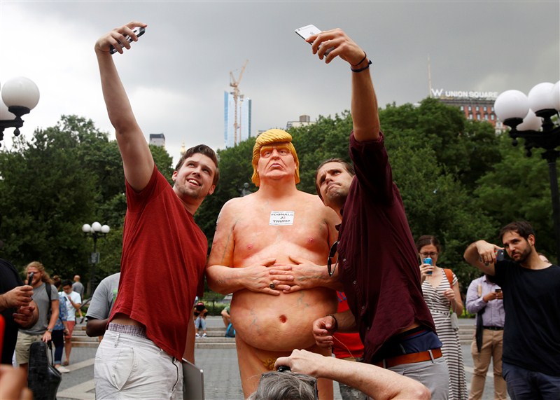 NYC parks workers remove a nude statue of Donald Trump from Union Square. Nude Donald Trump,Nude Donald Trump statue,Donald Trump Nude statue,Donald Trump Nude,Donald Trump statue removed,Nude statue,Union Square,NYC parks