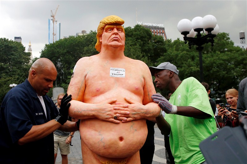 NYC parks workers remove a nude statue of Donald Trump from Union Square. Nude Donald Trump,Nude Donald Trump statue,Donald Trump Nude statue,Donald Trump Nude,Donald Trump statue removed,Nude statue,Union Square,NYC parks