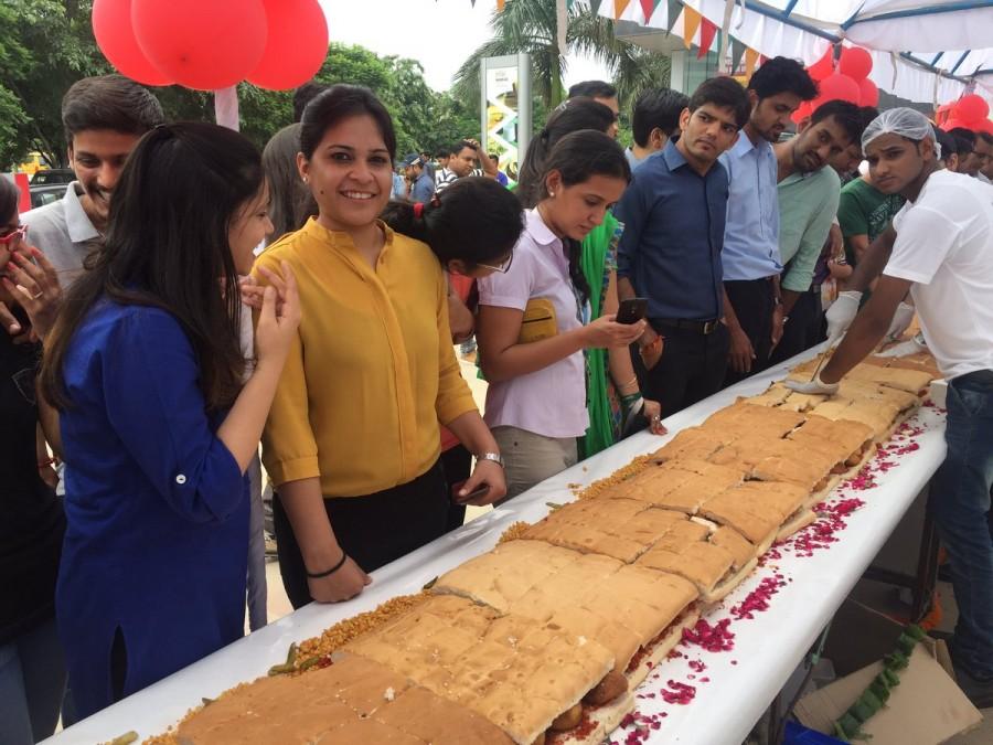 A team of 25 people used 200 kg of potatoes and bread each to make the world's longest Vada Pao in just three hours -- 145 feet long. So said a spokesperson for Nukkadwala, a chain of restaurants which brings street food from across India, on Tuesday, the World Vada Pao Day. Vada Pao,Longest Vada Pao,Worlds Longest Vada Pao,Big Vada Pao,Biggest Vada Pao,145 feet Vada Pao,World's longest Vada Pao