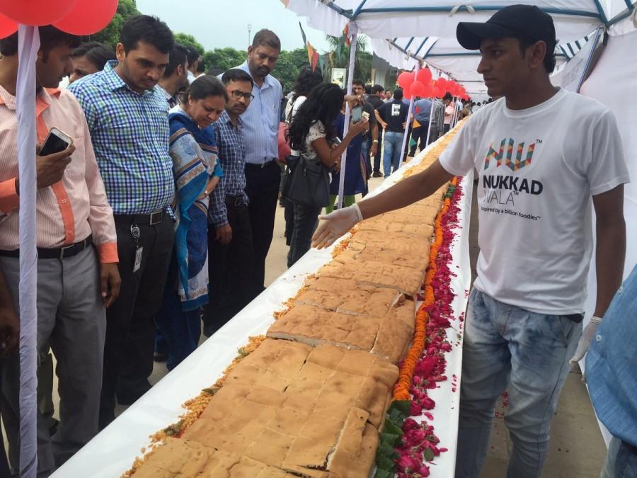 A team of 25 people used 200 kg of potatoes and bread each to make the world's longest Vada Pao in just three hours -- 145 feet long. So said a spokesperson for Nukkadwala, a chain of restaurants which brings street food from across India, on Tuesday, the World Vada Pao Day. Vada Pao,Longest Vada Pao,Worlds Longest Vada Pao,Big Vada Pao,Biggest Vada Pao,145 feet Vada Pao,World's longest Vada Pao