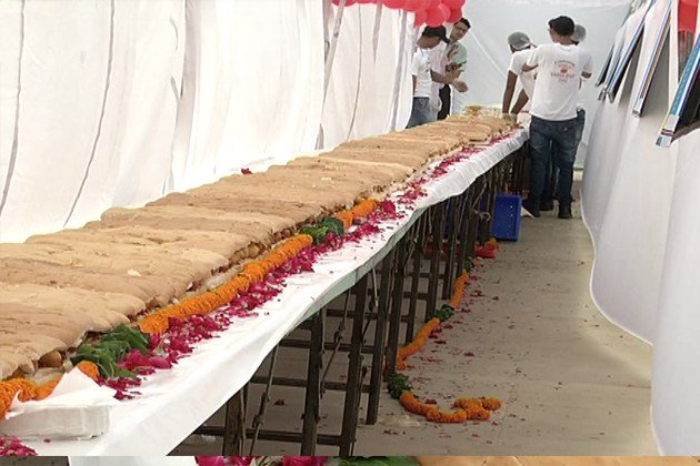 A team of 25 people used 200 kg of potatoes and bread each to make the world's longest Vada Pao in just three hours -- 145 feet long. So said a spokesperson for Nukkadwala, a chain of restaurants which brings street food from across India, on Tuesday, the World Vada Pao Day. Vada Pao,Longest Vada Pao,Worlds Longest Vada Pao,Big Vada Pao,Biggest Vada Pao,145 feet Vada Pao,World's longest Vada Pao