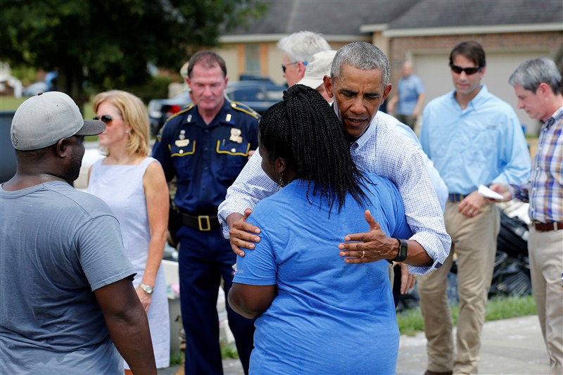President Barack Obama walked door to door in an East Baton Rouge Parish neighborhood hugging people and offering assurances that the country would help them recover from some of the worst floods ever recorded in Louisiana. President Barack Obama,Barack Obama,Obama visits Louisiana floods victims,Barack Obama visits floods victims,Louisiana floods victims,Louisiana