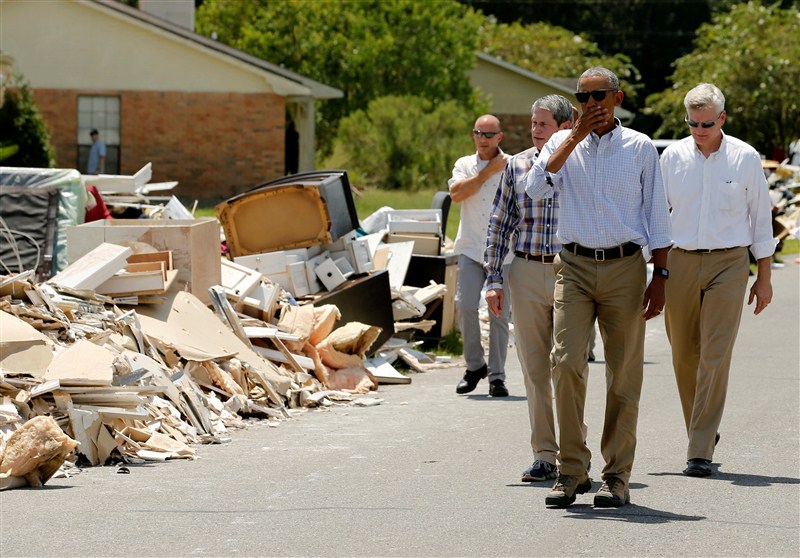 President Barack Obama walked door to door in an East Baton Rouge Parish neighborhood hugging people and offering assurances that the country would help them recover from some of the worst floods ever recorded in Louisiana. President Barack Obama,Barack Obama,Obama visits Louisiana floods victims,Barack Obama visits floods victims,Louisiana floods victims,Louisiana