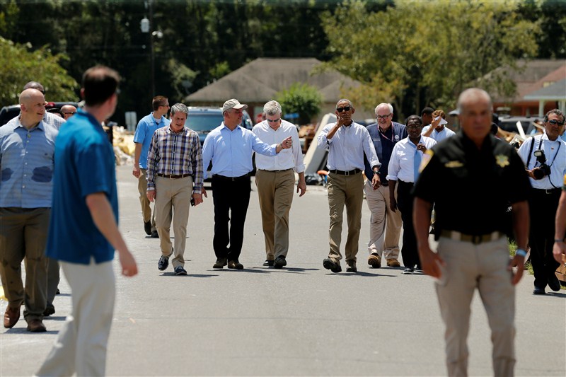 President Barack Obama walked door to door in an East Baton Rouge Parish neighborhood hugging people and offering assurances that the country would help them recover from some of the worst floods ever recorded in Louisiana. President Barack Obama,Barack Obama,Obama visits Louisiana floods victims,Barack Obama visits floods victims,Louisiana floods victims,Louisiana