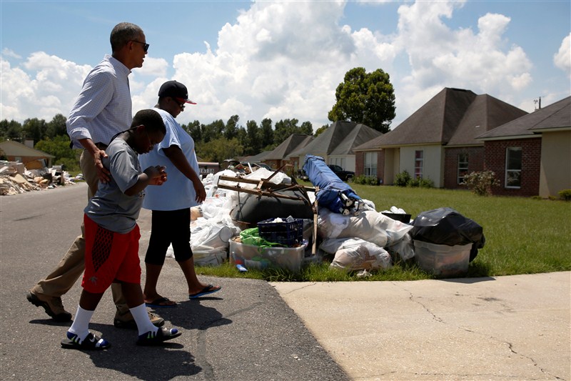 President Barack Obama walked door to door in an East Baton Rouge Parish neighborhood hugging people and offering assurances that the country would help them recover from some of the worst floods ever recorded in Louisiana. President Barack Obama,Barack Obama,Obama visits Louisiana floods victims,Barack Obama visits floods victims,Louisiana floods victims,Louisiana