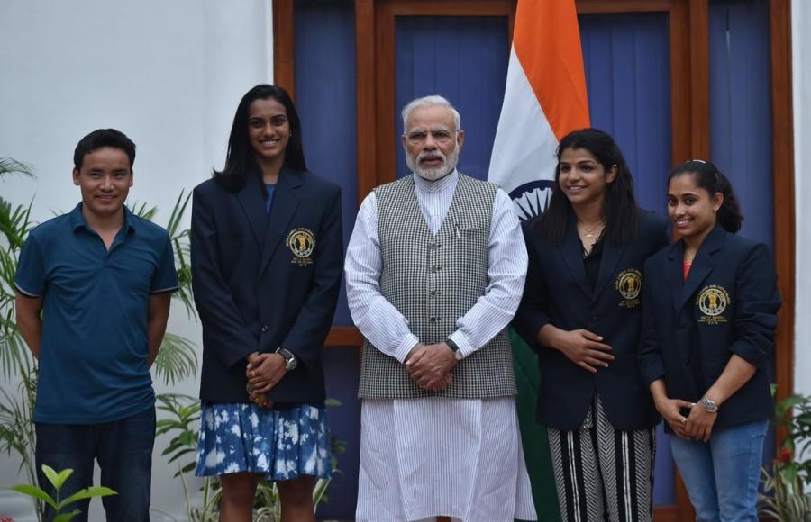 Prime Minister Narendra Modi met Rio Olympics silver medallist P.V. Sindhu and bronze medal winner Sakshi Malik at his residence here on Sunday. National Sports Day,National Sports Day 2016,PM Narendra Modi,Narendra Modi,Narendra Modi meets P.V. Sindhu,Sakshi Malik,Dipa Karmakar,Narendra Modi meets Sakshi Malik,Narendra Modi meets Dipa Karmakar