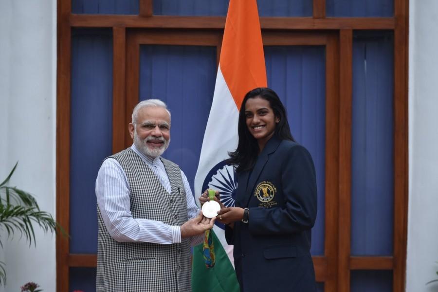 Prime Minister Narendra Modi met Rio Olympics silver medallist P.V. Sindhu and bronze medal winner Sakshi Malik at his residence here on Sunday. National Sports Day,National Sports Day 2016,PM Narendra Modi,Narendra Modi,Narendra Modi meets P.V. Sindhu,Sakshi Malik,Dipa Karmakar,Narendra Modi meets Sakshi Malik,Narendra Modi meets Dipa Karmakar