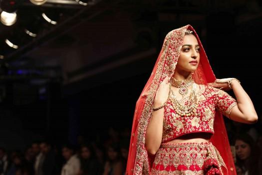Actress Radhika Apte played muse to Kolkata-based designer Saroj Jalan, at the Lakme Fashion Week (LFW) Winter/Festive 2016 and she looked no less than a bride in a red lehenga teamed up with a maang tikka.