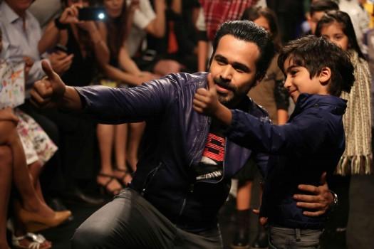 Bollywood actor Emraan Hashmi walks the ramp with his son Ayaan Hashmi at the Hamleys Show in Lakme Fashion Week 2016.