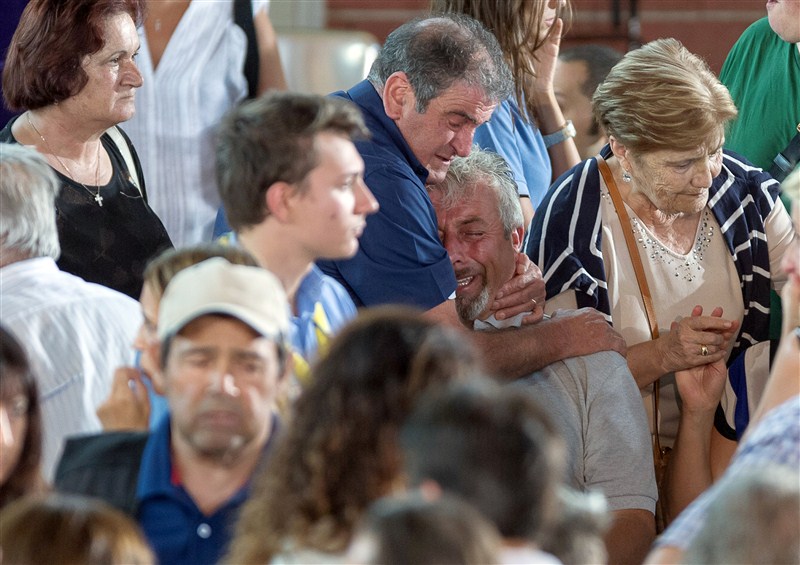 Friends and family grieve for their loved ones after a devastating earthquake struck central Italy. Italy,earthquake,funeral,amatrice,renzi,mattarella,State funeral in Italy honours quake victims,State funeral for quake victims,Italy honours quake victims,Italy quake victims