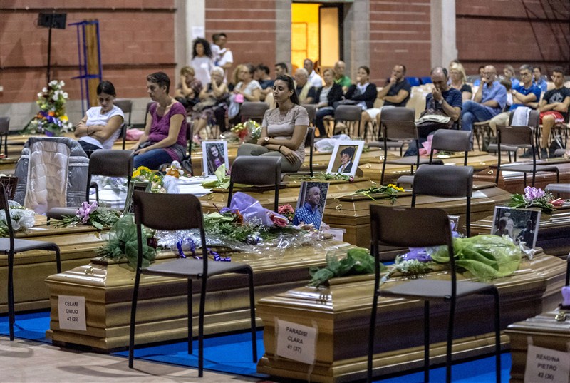 Friends and family grieve for their loved ones after a devastating earthquake struck central Italy. Italy,earthquake,funeral,amatrice,renzi,mattarella,State funeral in Italy honours quake victims,State funeral for quake victims,Italy honours quake victims,Italy quake victims