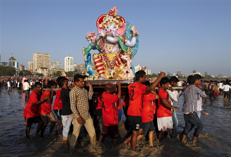 Devotees carry an idol of the Hindu god Ganesh, the deity of prosperity, into the Arabian Sea on the second day of Ganesh Chaturthi festival in in Mumbai. Ganesh Visarjan,Lord Ganesh Visarjan,Ganesh Visarjan 2016,Ganesh Visarjan pics,Ganesh Visarjan images,Ganesh Visarjan photos,Ganesh Visarjan stills,Ganesh Visarjan pictures,Ganesh Chaturthi festival,Bye bye Ganesh Chaturthi
