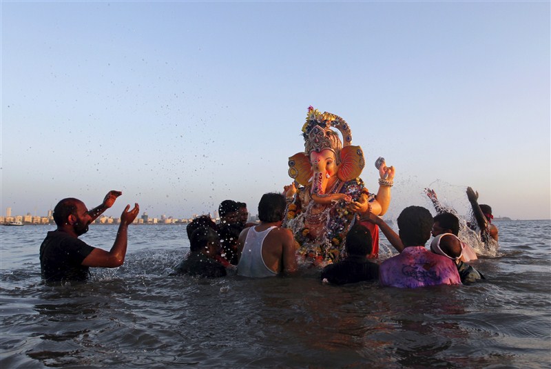 Devotees carry an idol of the Hindu god Ganesh, the deity of prosperity, into the Arabian Sea on the second day of Ganesh Chaturthi festival in in Mumbai. Ganesh Visarjan,Lord Ganesh Visarjan,Ganesh Visarjan 2016,Ganesh Visarjan pics,Ganesh Visarjan images,Ganesh Visarjan photos,Ganesh Visarjan stills,Ganesh Visarjan pictures,Ganesh Chaturthi festival,Bye bye Ganesh Chaturthi