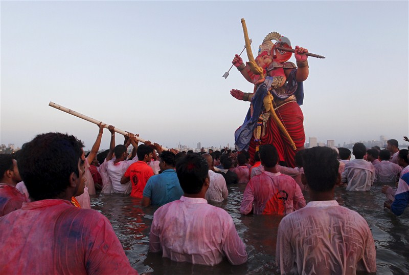 Devotees carry an idol of the Hindu god Ganesh, the deity of prosperity, into the Arabian Sea on the second day of Ganesh Chaturthi festival in in Mumbai. Ganesh Visarjan,Lord Ganesh Visarjan,Ganesh Visarjan 2016,Ganesh Visarjan pics,Ganesh Visarjan images,Ganesh Visarjan photos,Ganesh Visarjan stills,Ganesh Visarjan pictures,Ganesh Chaturthi festival,Bye bye Ganesh Chaturthi