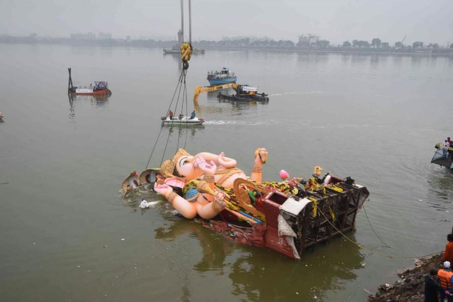 The immersion of Ganesh idols was underway in Hyderabad on Thursday with religious fervour and amid rain and tight security. Maha Ganapathi,Maha Ganapathi immersion,Maha Ganapathi immersion in Hyderabad,Ganapathi immersion in Hyderabad,Ganesh Visarjan,Ganesh Visarjan in Hyderabad,Ganesh Visarjan pics,Ganesh Visarjan images,Ganesh Visarjan photos,Ganesh Visarjan pictures