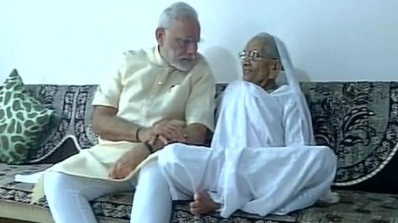 Prime Minister Narendra Modi on Saturday celebrated his 66th birthday with his mother Hira Ba in Gandhinagar, Gujarat. Narendra Modi,Modi celebrates birthday with his mother,Narendra Modi mother,Modi mother,Narendra Modi birthday,PM Modi,Narendra Modi birthday celebrations,Narendra Modi birthday pics,Narendra Modi birthday images,Narendra Modi birthday photos,Narendra Mod