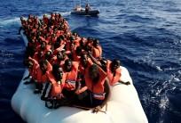 Migrants from African countries are rescued from an overcrowded dinghy off the Libyan coast in the Mediterranean Sea.