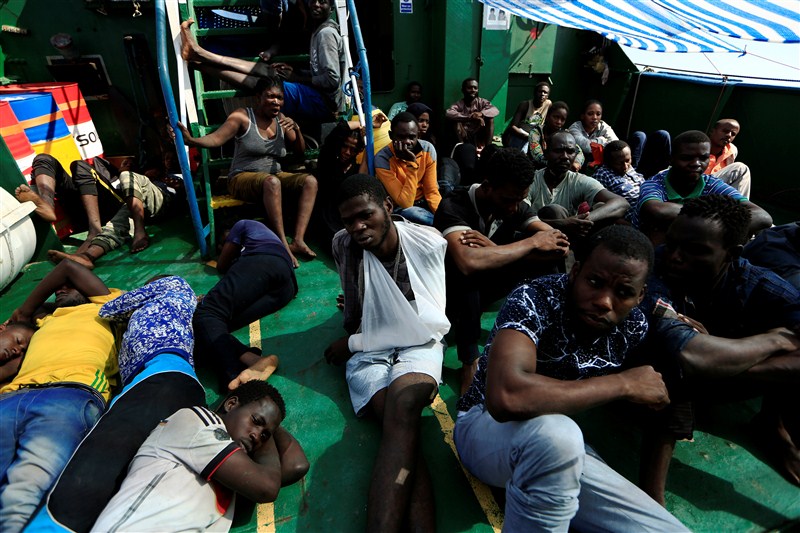 Migrants from African countries are rescued from an overcrowded dinghy off the Libyan coast in the Mediterranean Sea. Migrants from African countries,African countries,Migrants,Libyan coast,Mediterranean Sea,Migrants plucked from overloaded dinghy,Sicilian port