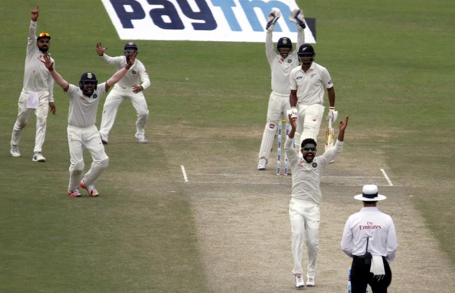 Riding on Ravichandran Ashwin and Ravindra Jadeja's brilliant bowling, New Zealand were bundled out by hosts India for 262 on the third day of the first Test at the Green Park stadium here on Saturday. New Zealand vs India,India vs New Zealand,India vs New Zealand Test series,New Zealand all out for 262,India leads by 56 runs,Ravichandran Ashwin,Ravindra Jadeja