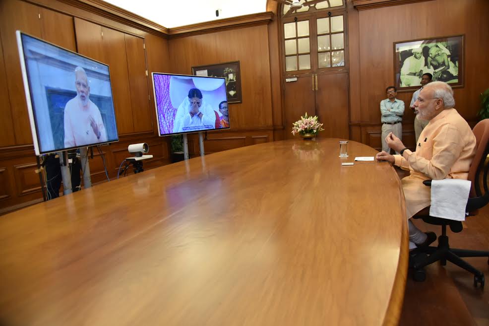 PM Narendra Modi interacts with Mata Amritanandamayi 'Amma' through video conferencing. Narendra Modi,Modi,Mata Amritanandamayi,Amma,Modi interacts with Mata Amritanandamayi,Modi interacts with Amma,Modi and Mata Amritanandamayi,Modi and Amma