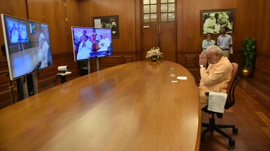 PM Narendra Modi interacts with Mata Amritanandamayi 'Amma' through video conferencing. Narendra Modi,Modi,Mata Amritanandamayi,Amma,Modi interacts with Mata Amritanandamayi,Modi interacts with Amma,Modi and Mata Amritanandamayi,Modi and Amma