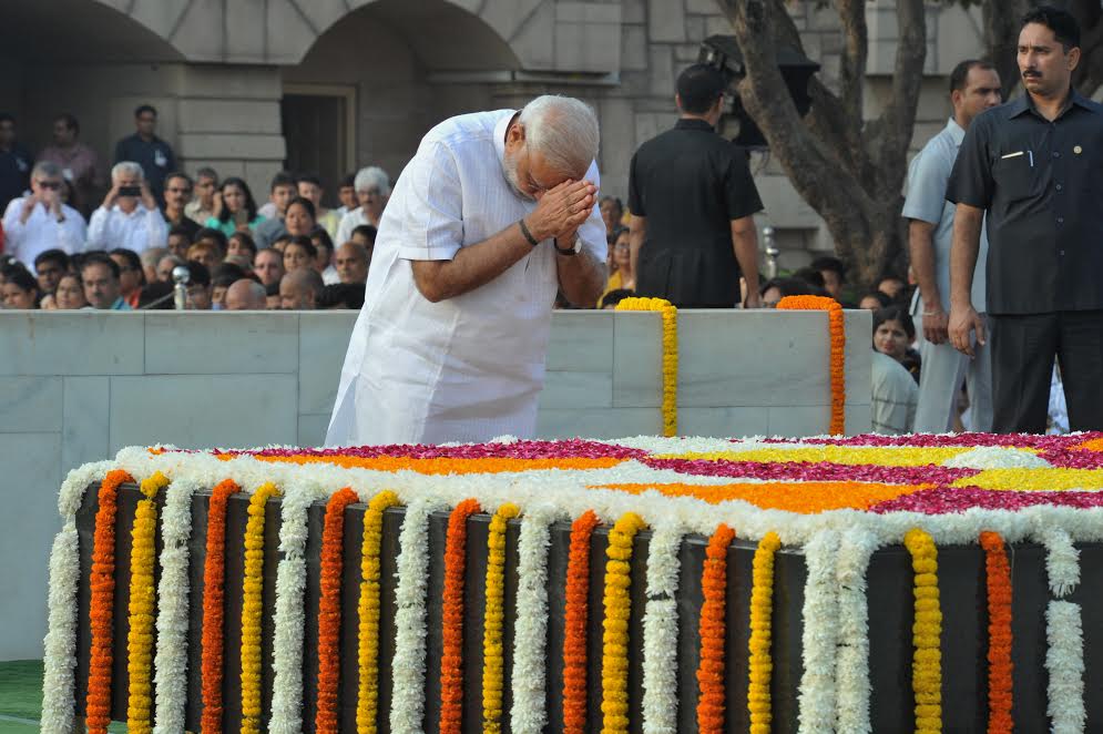 Prime Minister Narendra Modi on Sunday paid tribute to Mahatma Gandhi and Lal Bahadur Shastri at Rajghat and Vijay Ghat respectively on their birth anniversaries. The Prime Minister remembered the two leaders for the values they championed. Gandhi Jayanti,Gandhi Jayanti 2016,Narendra Modi pays tributes to Gandhi,Narendra Modi,PM Narendra Modi,Modi,Gandhi Jayanti at Rajghat,Gandhi Jayanti celebrations