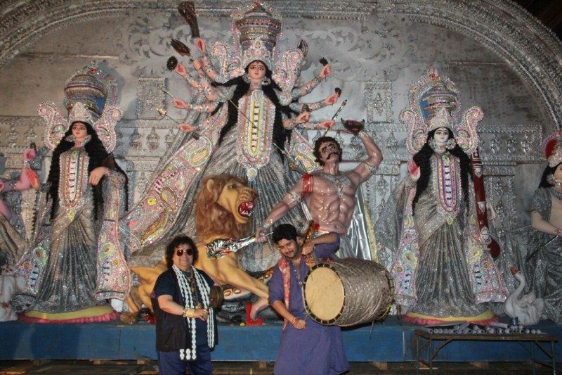 The festival of Durga Puja is colored with devotional zeal, mythological legends, detailed rituals, extravagant pandals and magnificent tableaus of the divine Mother Goddess coming with her children Ganesh, Kartik, Lakshmi and Saraswati from Kailash to Dharti (her parent's home). As the festival of Maa Durga is approaching, the father- son duo- Bappi Lahiri and Bappa Lahiri brings one of the oldest and the biggest Durga Puja- North Bombay Sarbojanin Durga Puja Samiti 2016 in Mumbai to seek the blessings of Maa Durga. Bappi Lahiri and Bappa Lahiri,Bappi Lahiri,Bappa Lahiri,Sarbojanin Durga Puja Samiti 2016,Sarbojanin Durga Puja Samiti,Durga Puja Samiti 2016,Durga Puja