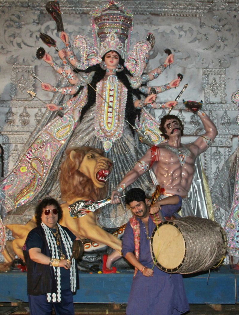 The tradition continues from generation to generation of making this puja "GHARUA PUJA" (family puja) where all are welcome to seek the blessings of Maa Durga "We have been following the traditions set by our elders from generation to generation. Our puja is well known as a "GHARUA PUJA" which means all are welcome to become a part of our puja family. We welcome each & everyone to be a part of North Bombay Sarbojanin Durga Puja Samiti family and seek the blessings of Maa Durga". Bappi Lahiri and Bappa Lahiri,Bappi Lahiri,Bappa Lahiri,Sarbojanin Durga Puja Samiti 2016,Sarbojanin Durga Puja Samiti,Durga Puja Samiti 2016,Durga Puja