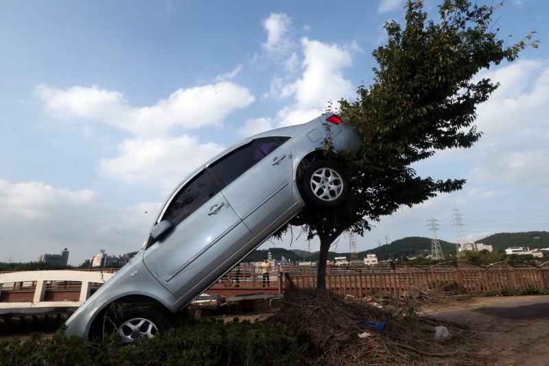 A car damaged by typhoon Chaba is seen in Ulsan, South Korea. Typhoon Chaba,Typhoon Chaba batters South Korea,Typhoon Chaba hits South Korea,heavy rain in South Korea,flooding in South Korea,Typhoon Chaba batters South Korea and heads to Japan,Typhoon Chaba photos,Typhoon Chaba pics,Typhoon Chaba images,Typhoon Chab
