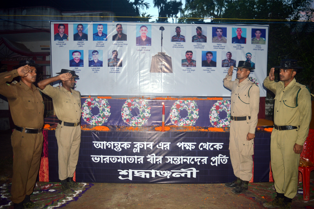 Departing from the normal, a Durga Puja pandal (marquee) here is paying tribute to the 19 Indian Army soldiers martyred in a terrorist attack on their camp in Uri in Jammu and Kashmir last month. Thousands of puja revellers thronged the Agantuk Club Durga Puja pandal (marquee) here to pray before the goddess and pay their respects to the martyred soldiers. "We have displayed the photographs of those martyred in Uri to keep alive the memory of their sacrifice," Kanraj Sarkar, a senior member of the Agantuk Club, told IANS. "TSR (Tripura State Rifles) troopers also paid their homage to the slain soldiers," he added. Agartala Durga Puja,Uri martyrs,Durga Puja pandal,Uri in Jammu and Kashmir,terrorist attack,Durga Puja,Indian Army soldiers,Indian Army