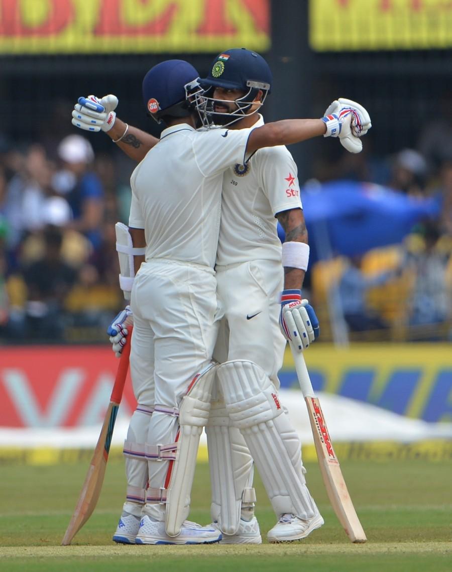 Kohli continued to bat in the post-lunch session with the same authority, maintaining a high scoring rate and slammed his second double-ton in Tests. At 199, Kiwi pacer Henry delivered a length ball and Kohli rolled his wrists nicely to work it towards deep square and became the first Indian to score two double tons as captain. Rahane, on the other hand, was not so fluent, but supported his skipper from the other end. The Mumbai batsman scored his first 150 of his career. Virat Kohli,Ajinkya Rahane,Virat Kohli and Ajinkya Rahane,India vs New Zealand,India vs New Zealand Test series,India vs New Zealand score,India vs New Zealand 3rd Test,India vs New Zealand pics,India vs New Zealand images,India vs New Zealand photos,Indi