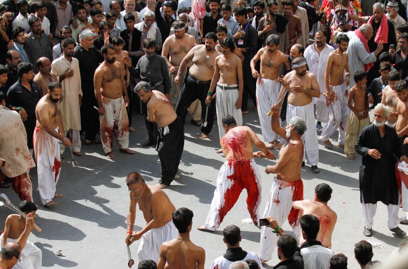 Men participate in self flagellation during the Shi'ite Muharram procession in Peshawar, Pakistan. Muharram,Muharram procession,Muharram procession in Peshawar,Men participate in Muharram procession,Muharram procession pics,Muharram procession images,Muharram procession photos,Muharram procession stills,Muharram procession pictures,Muharram celebration