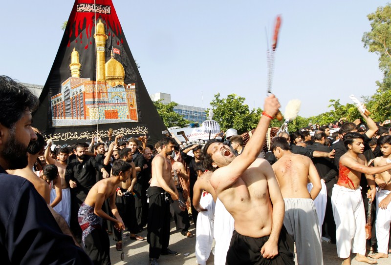 Men participate in self flagellation during the Shi'ite Muharram procession in Islamabad, Pakistan. Muharram,Muharram procession,Muharram procession in Peshawar,Men participate in Muharram procession,Muharram procession pics,Muharram procession images,Muharram procession photos,Muharram procession stills,Muharram procession pictures,Muharram celebration