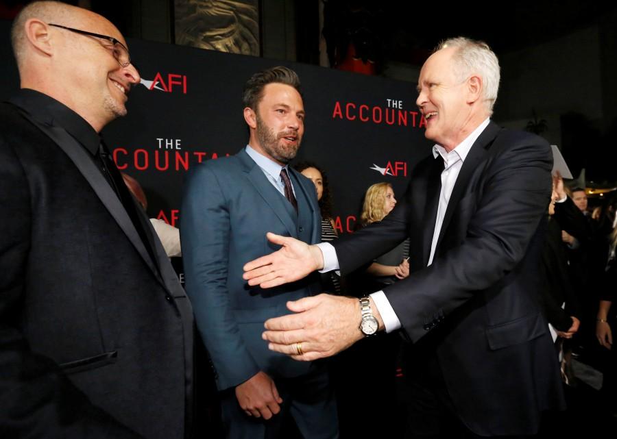 Director Gavin O'Connor (L) greets cast members Ben Affleck (C) and John Lithgow at the premiere of "The Accountant" at the TCL Chinese theatre in Hollywood, California. Ben Affleck,Anna Kendrick,The Accountant,The Accountant premiere show,Celebs at The Accountant premiere show,The Accountant premiere show pics,The Accountant premiere show images,The Accountant premiere show photos,The Accountant premiere show stills,The