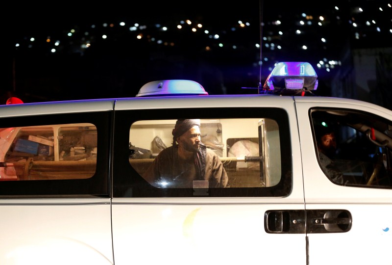 An Afghan man sits inside an ambulance after an attack in Kabul, Afghanistan. Attacks on Afghan mosques,Afghan mosques,Attacks on mosques,Shi'ite Muslims,Ashura,Mazar-i-Sharif,Bomb Blast mosque,Bomb Blast,mosque Bomb Blast