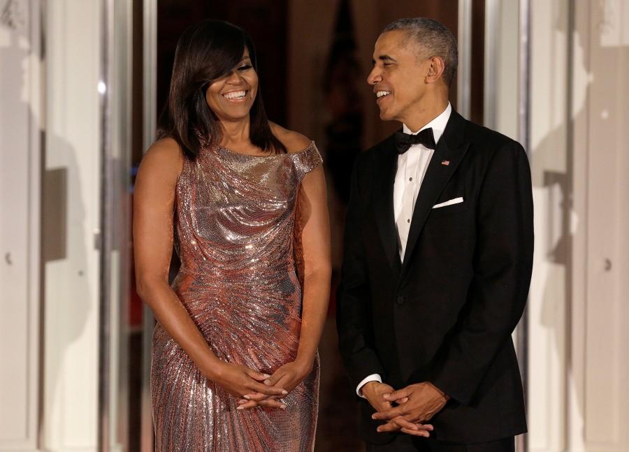 President Barack Obama and first lady Michelle Obama speak before the arrival of Italian Prime Minister Matteo Renzi and his wife Agnese Landini. Barack Obama,Obamas' last state dinner,Obamas' last state dinner at White House,White House,last state dinner,Michelle Obama,Matteo Renzi,Agnese Landini,Obamas' last state dinner pics,Obamas' last state dinner images,Obamas' last