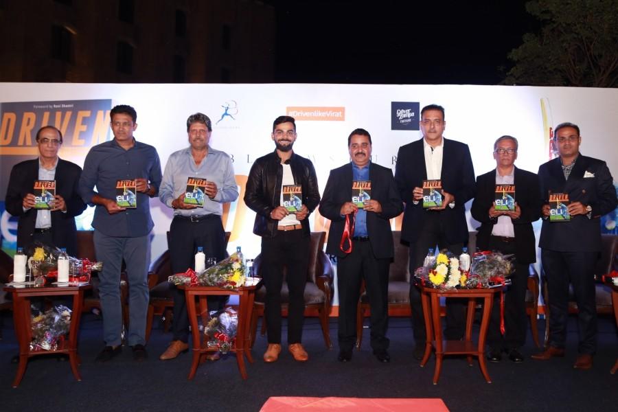 India Test captain Virat Kohli, chief coach Anil Kumble, team director Ravi Shastri, former Indian cricketers Kapil Dev and Virender Sehwag during the book release "Driven: The Virat Kohli Story" authored by Vijay Lokapally in New Delhi on Oct 18, 2016. Virat Kohli,Anil Kumble,coach Anil Kumble,Ravi Shastri,Kapil Dev,Virender Sehwag,Driven: The Virat Kohli Story,The Virat Kohli Story