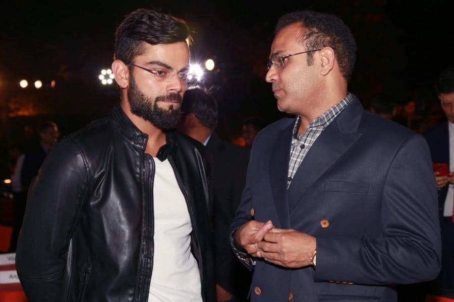 ndia Test captain Virat Kohli and former Indian cricketer Virender Sehwag during the book release "Driven: The Virat Kohli Story" authored by Vijay Lokapally in New Delhi on Oct 18, 2016. Virat Kohli,Anil Kumble,coach Anil Kumble,Ravi Shastri,Kapil Dev,Virender Sehwag,Driven: The Virat Kohli Story,The Virat Kohli Story