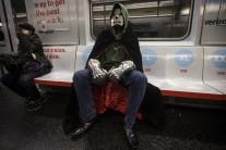 A man in costume rides the shuttle subway from Times Square to Grand Central Terminal in the Manhattan borough of New York.