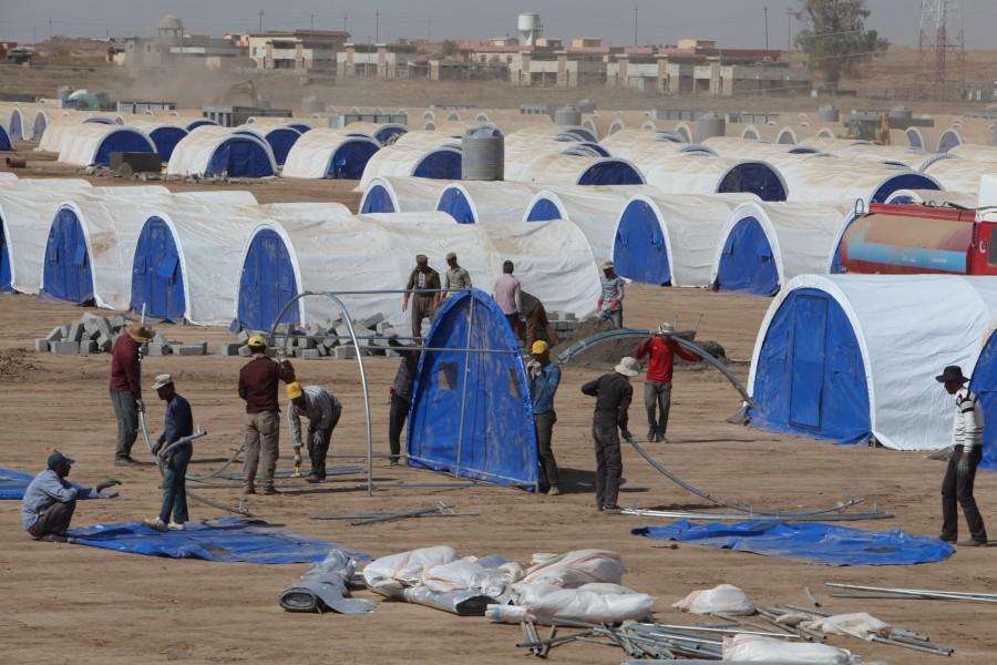 Workers prepare a tent camp in Khazer west of the Kurdish regional capital Erbil, Iraq for people expected to flee Mosul because of the battles with Islamic State. Mosul,Iraqi forces,Islamic State,assault on Mosul,Mosul offensive,Mosul civilians,Fleeing Mosul,Assault on ISIS in Mosul,Assault on ISIS,ISIS