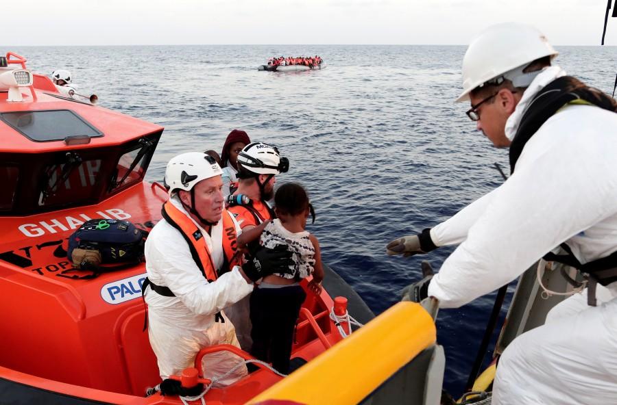 Migrants are seen during rescue operation in the Mediterranea Sea. Migrant rescue,Migrant,Mediterranean Sea,Operation in Mediterranean rescues,Migrants Rescued,Migrant rescues,Boat migrant rescues,refugees