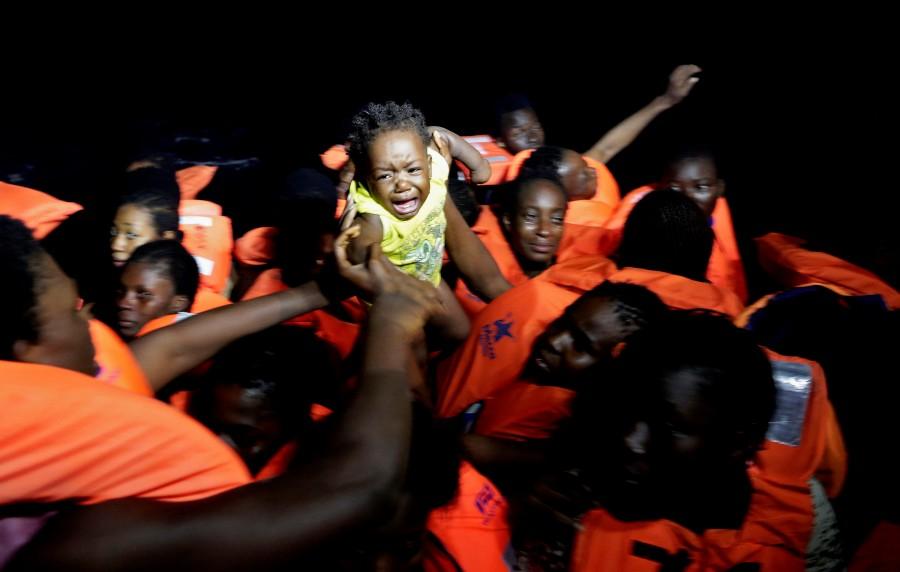 Migrants are seen during rescue operation in the Mediterranea Sea. Migrant rescue,Migrant,Mediterranean Sea,Operation in Mediterranean rescues,Migrants Rescued,Migrant rescues,Boat migrant rescues,refugees