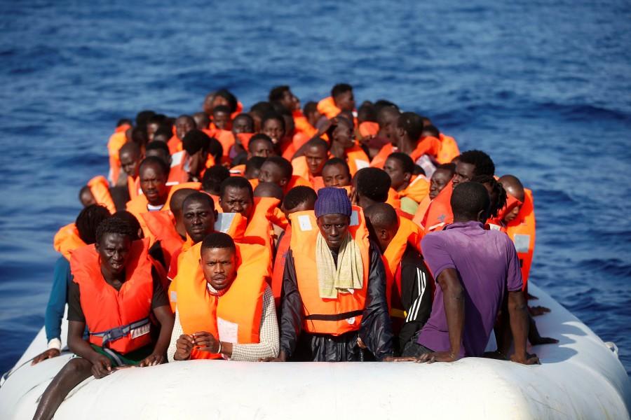 Migrants are seen during rescue operation in the Mediterranea Sea. Migrant rescue,Migrant,Mediterranean Sea,Operation in Mediterranean rescues,Migrants Rescued,Migrant rescues,Boat migrant rescues,refugees