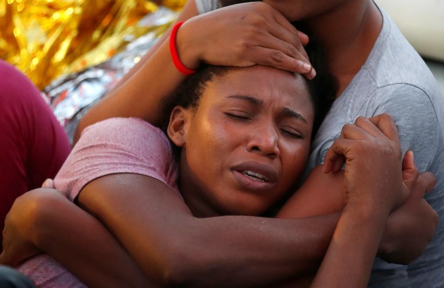 Migrants are seen during rescue operation in the Mediterranea Sea. Migrant rescue,Migrant,Mediterranean Sea,Operation in Mediterranean rescues,Migrants Rescued,Migrant rescues,Boat migrant rescues,refugees